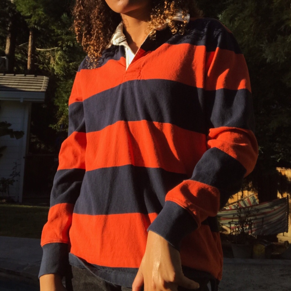 orange and navy blue rugby shirt collared
